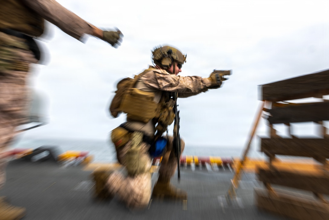 A U.S. Marine with Battalion Landing Team 3/5, 11th Marine Expeditionary Unit, fires an M18 pistol during combat marksmanship training aboard Wasp-class amphibious assault ship USS Boxer (LHD 4) in the U.S. Central Command area of responsibility, Aug. 9, 2026. (U.S. Marine Corps photo by Sgt. Trent A. Henry)