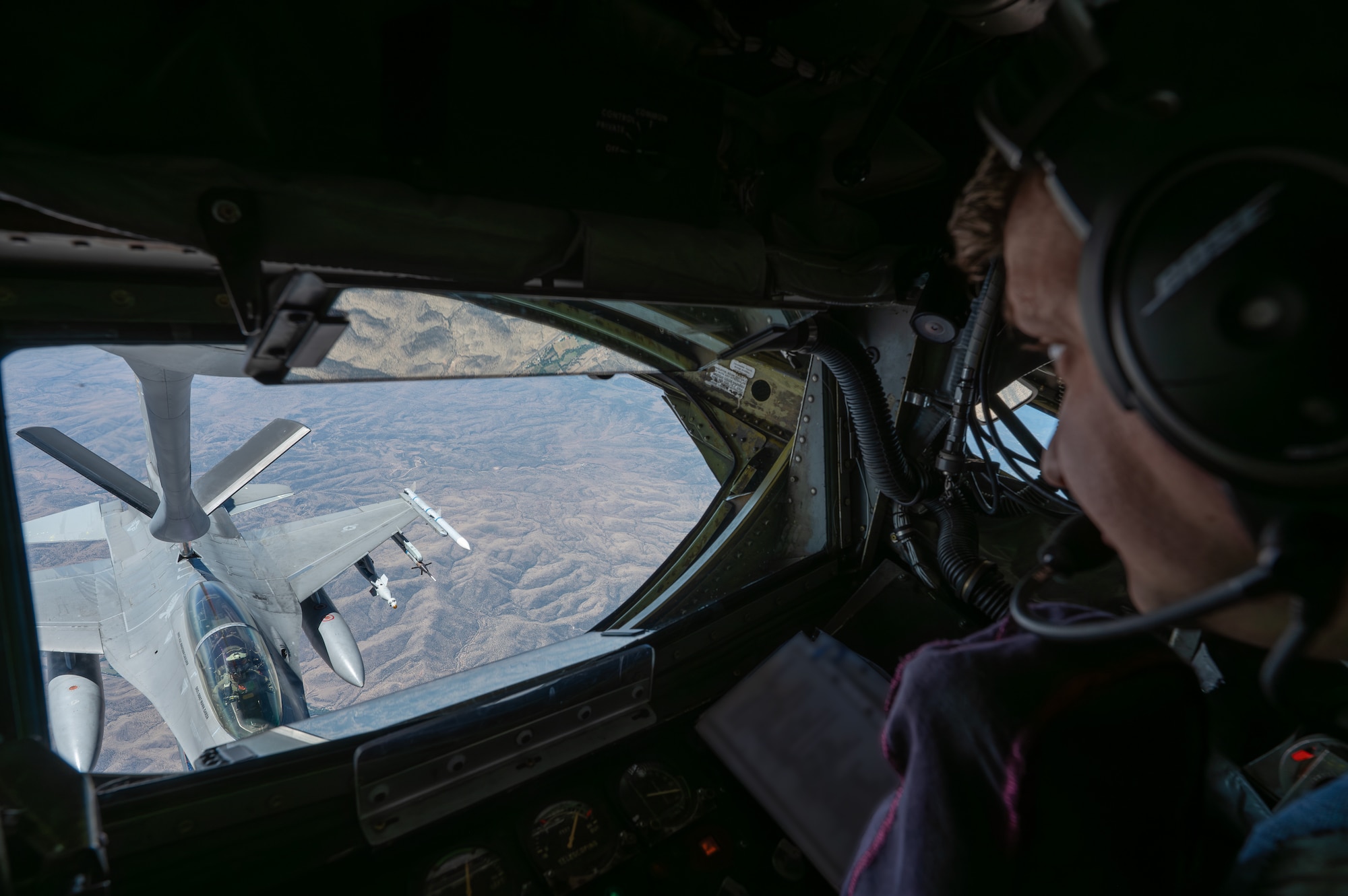 U.S. Air Force Staff Sgt. Gabriel Padilla, 93rd Air Refueling Squadron boom operator, refuels a U.S. AF F-16 Fighting Falcon over the southwest region of America, July 29, 2026.