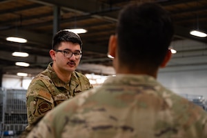 U.S. Air Force Senior Airman Matthew Thompson, 87th Logistics Readiness Squadron individual protective equipment journeyman, assists Airmen during a personnel deployment function line at Joint Base McGuire-Dix-Lakehurst, N.J., Aug. 24, 2026. Personnel deployment function lines are vital in providing the proper equipment, documentation and resources available to Airmen and families surrounding their deployment. (U.S. Air Force photo by Airman 1st Class Haeleigh Bayle)