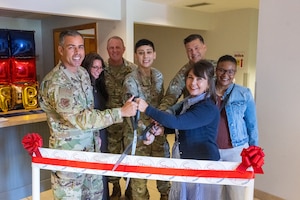 Dover Air Force Base leaders and their spouses participate in a ribbon-cutting ceremony for the Spouse Space at Dover Air Force Base, Delaware, Aug. 25, 2026. The space is scheduled to begin hosting events in September for spouses, families and other members of Team Dover. (U.S. Air Force photo by Mauricio Campino)