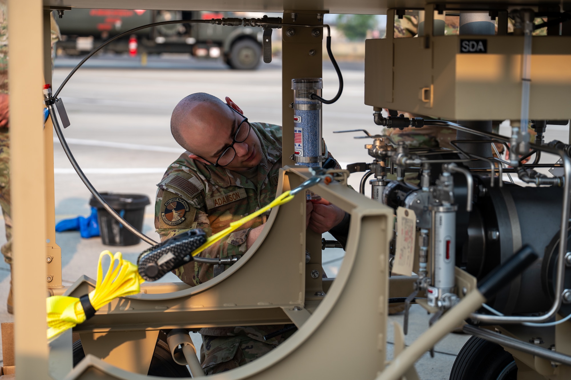 U.S. Air Force Staff Sgt. Mason Adamson, 92nd Logistics Readiness Squadron fuels information Service Center member, works on refueling equipment during the Combat Readiness Exercise at Fairchild Air Force Base, Washington, Aug. 7, 2026.