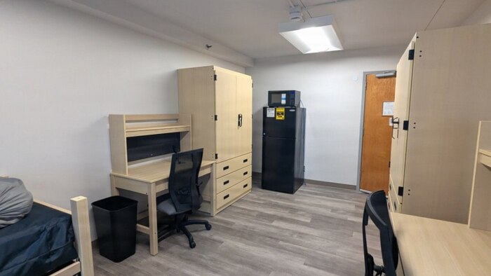 A photo of a renovated room in an Unaccompanied Housing (UH) building – commonly known as barracks – on Naval Base Kitsap-Bremerton. The 10-story, 152-room barracks received full-scale interior renovation and new furnishing following fire and water damage sustained in August 2025. The milestone marks the first of the Navy’s six major sustainment, restoration, and modernization projects funded through the Barracks Task Force to reach completion, directly advancing the Navy’s “No Sailor Living Afloat” initiative – a drive to move Sailors off docked ships and into high-quality shore housing – and the Commander, Navy Installations Command (CNIC) Quality of Service improvement efforts.