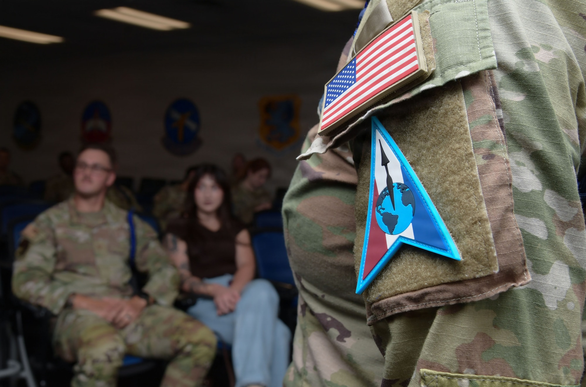A U.S. Space Force patch is displayed on the arm of a uniform.