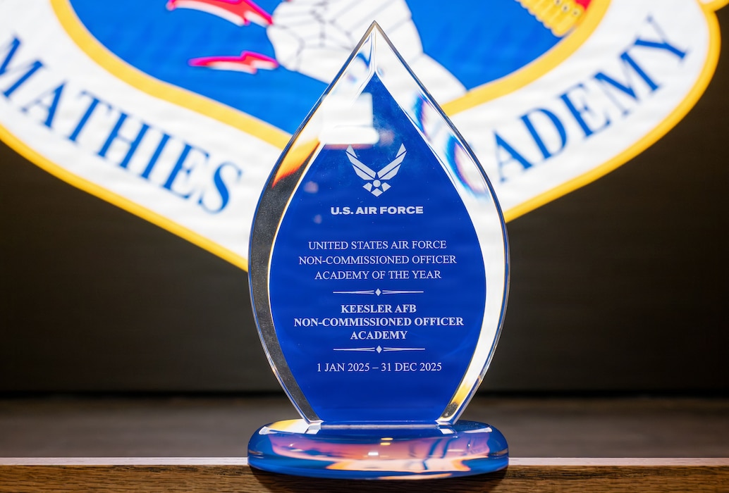 A bule glass trophy is on display.