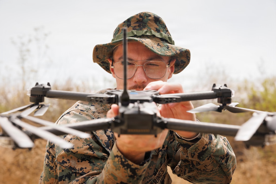 U.S. Marine Corps Sgt. Dillon Buck, an advanced combat videographer with Communication Strategy and Operations, Marine Corps Installations West, Marine Corps Base Camp Pendleton, conducts a pre-flight check of the SKYDIO X2D Small Unmanned Aircraft System at Marine Corps Base Camp Pendleton, Calif., Aug. 13, 2026. Certified drone operators can contribute to COMMSTRAT operations on Camp Pendleton including public affairs events, training environments, battle damage assessments, investigations and emergency responses. 
(U.S. Marine Corps photo by Lance Cpl. Ana Kalajzic)