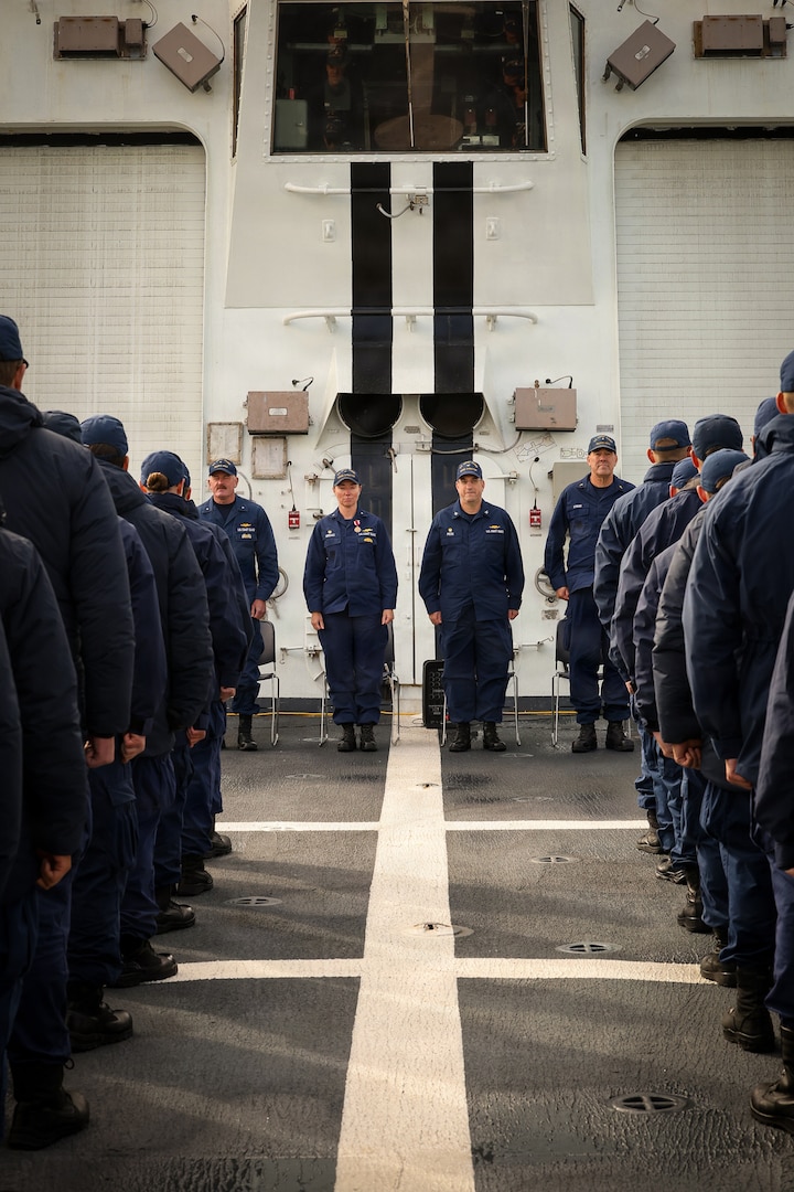 U.S. Coast Guard Rear Adm. Dorothy Hernaez and Capt. Matthew Press stand before the crew of the U.S. Coast Guard Legend-class national security cutter Stratton (WMSL 752) during a change of command ceremony while anchored off the coast of Kotzebue, Alaska, Aug. 24, 2026.