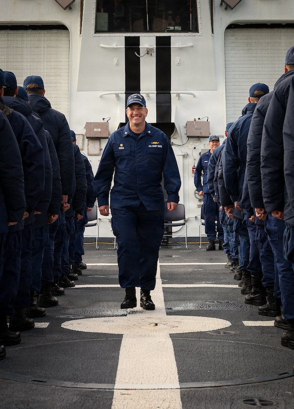 U.S. Coast Guard Capt. Matthew Press walks through the ranks of the U.S. Coast Guard Legend-class national security cutter Stratton (WMSL 752) crew after officially assuming command during a change of command ceremony while anchored off the coast of Kotzebue, Alaska, Aug. 24, 2026.