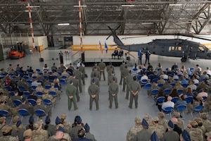 Service members standing at ease.