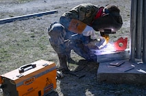 Steelworker 2nd Class Autumn Bridges, assigned to Amphibious Construction Battalion (ACB) 1, welds a structural steel frame as part of a Pacific Partnership 2026 (PP26) engineering project at the Escola Básica Filial Kasnafar schoolhouse in Dili, Timor-Leste, Aug. 20, 2026.