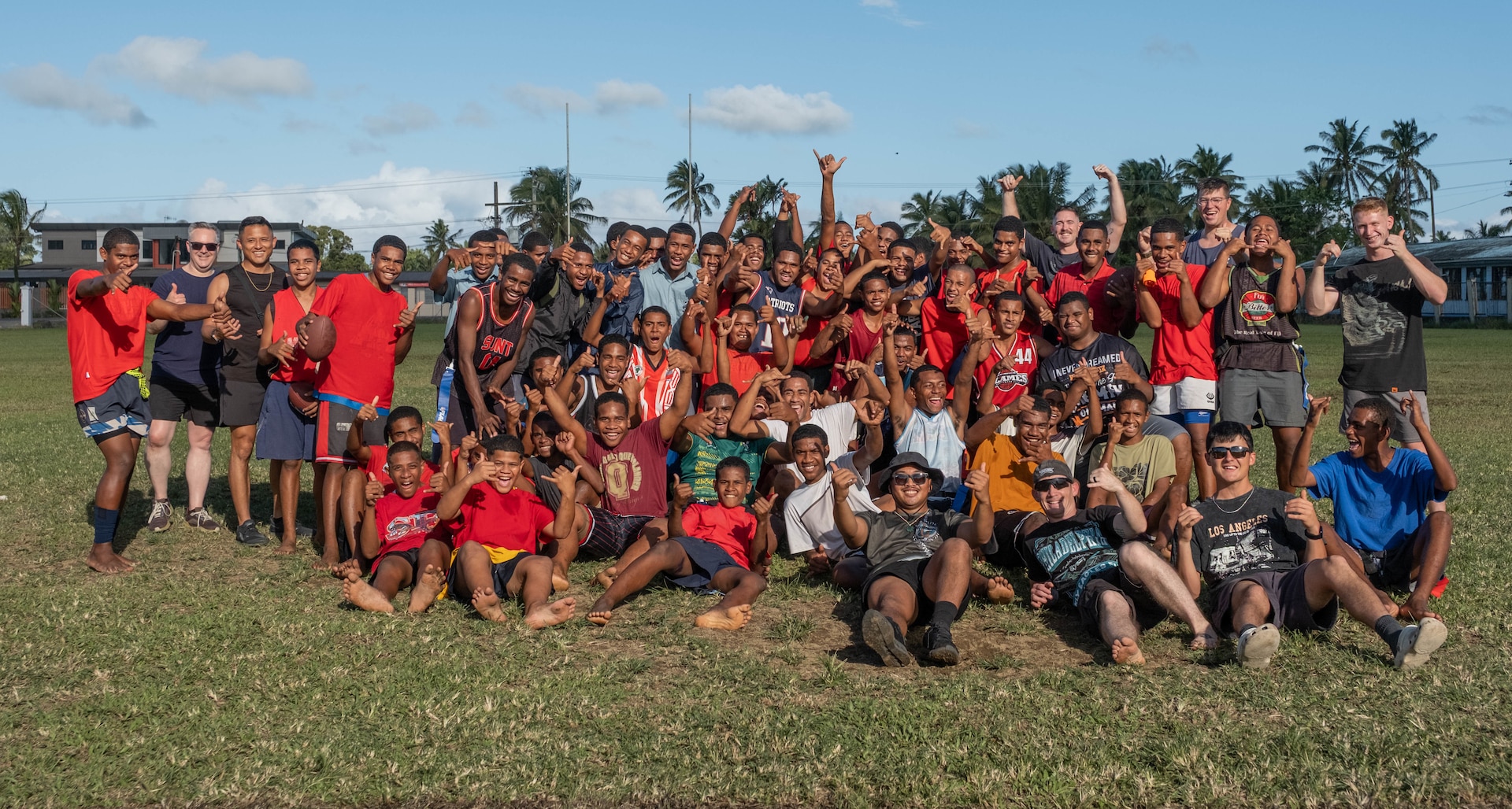 Crew assigned to Coast Guard Cutter Harriet Lane (WMEC 903), pose for a picture with students at Sila Central High School in Fiji, June 18, 2026. The crew participated in a sports day, building relationships in the local community. (U.S. Coast Guard photo, courtesy CGC Harriet Lane)