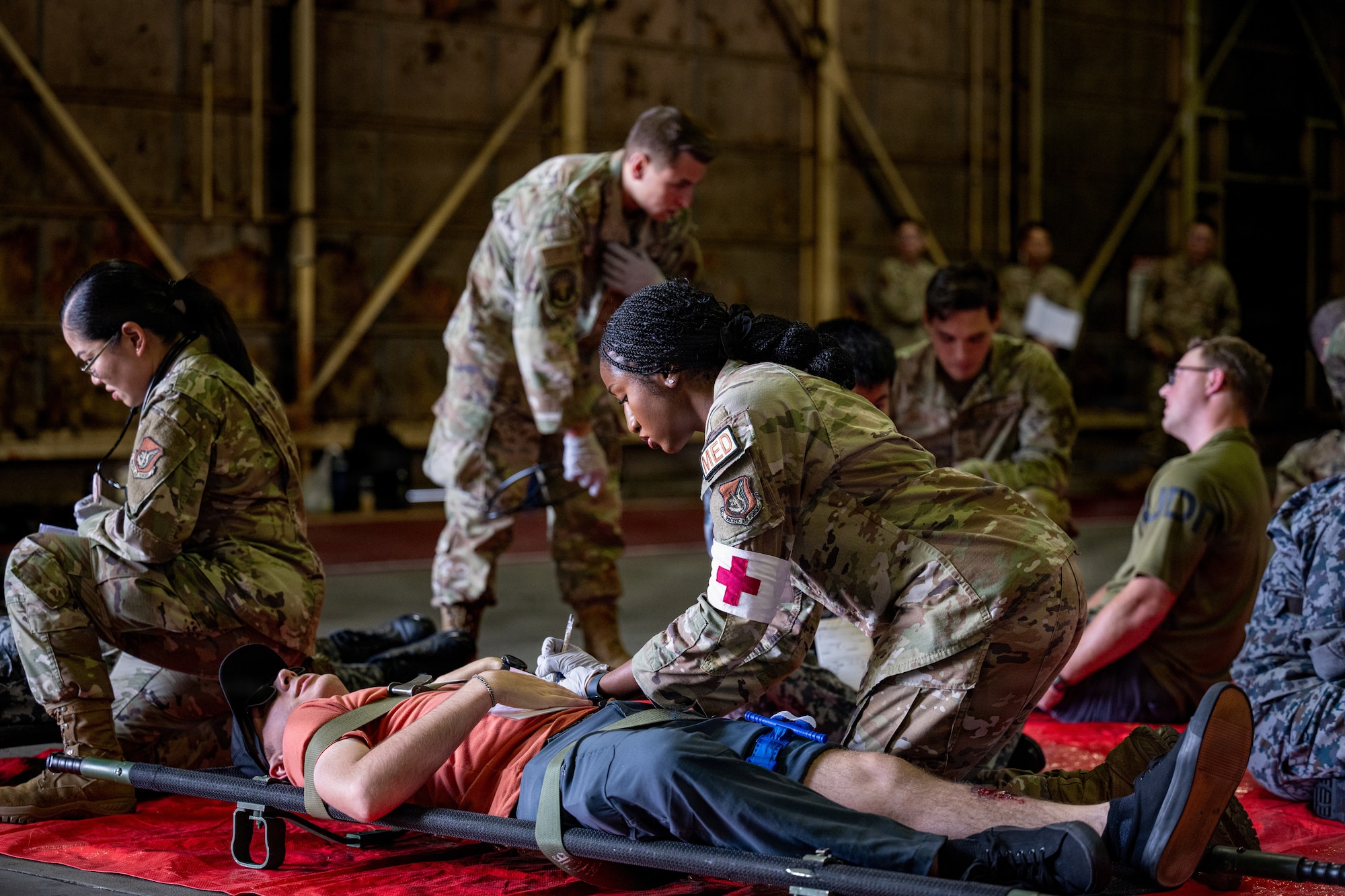 U.S. Airmen assigned to the 35th Medical Group operate a casualty collection point for simulated patients during an aircraft mass casualty exercise.