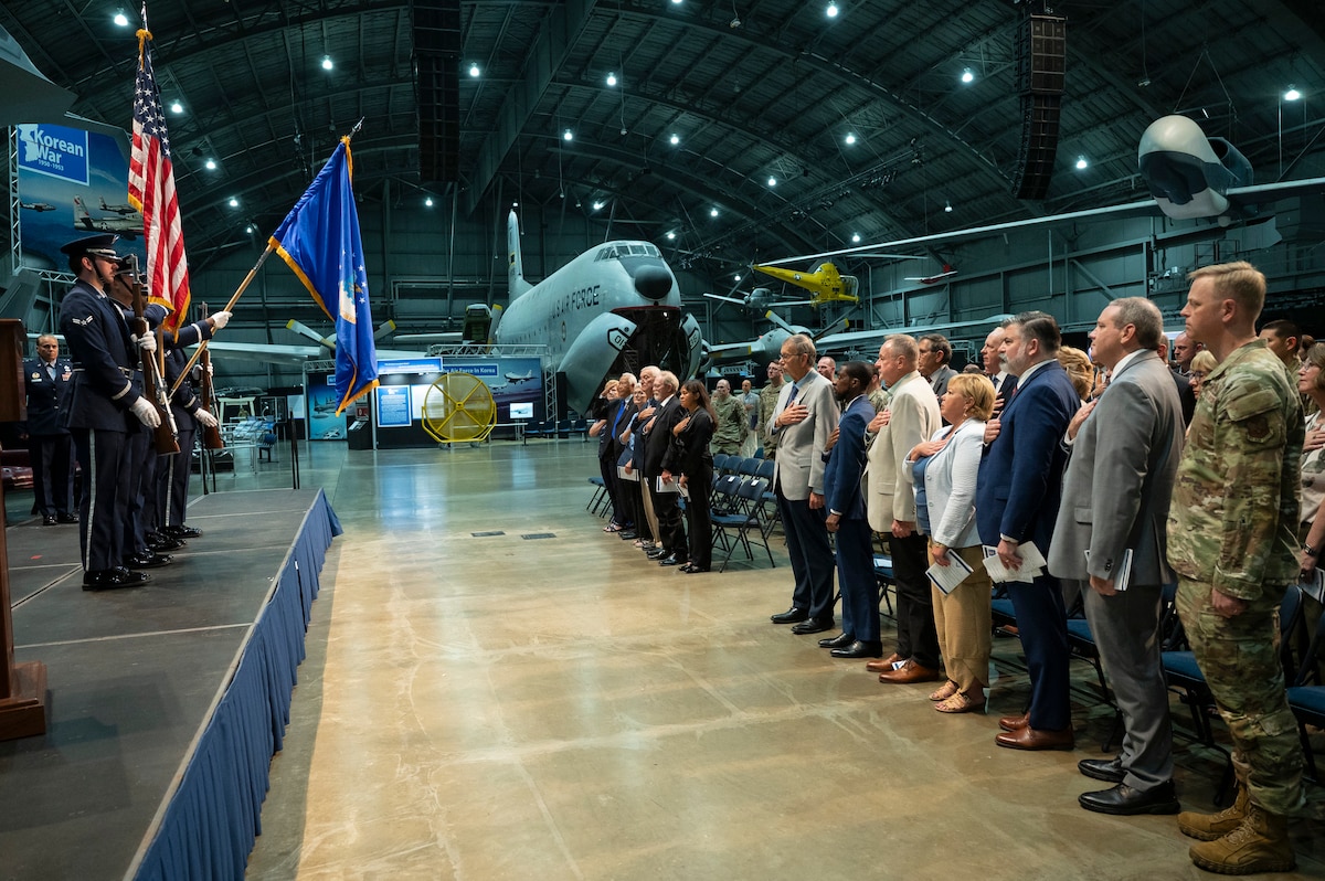 People standing for USA National Anthem