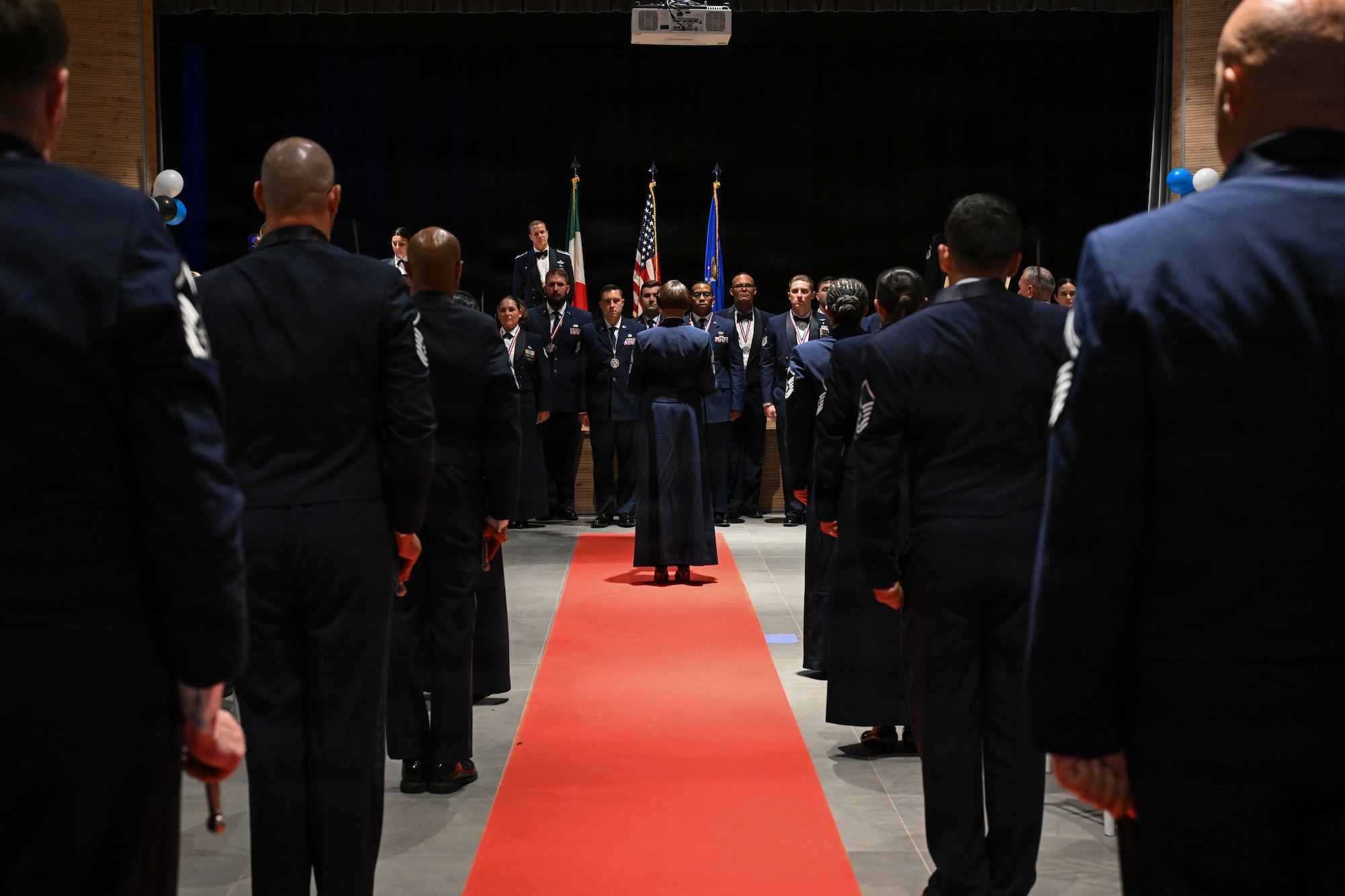 U.S. Air Force Chief Master Sgt. Tiffany Griego, 31st Fighter Wing command chief, addresses newly selected senior noncommissioned officers during their Senior Noncommissioned Officer Induction ceremony near Aviano Air Base, Italy, Aug. 21, 2026.