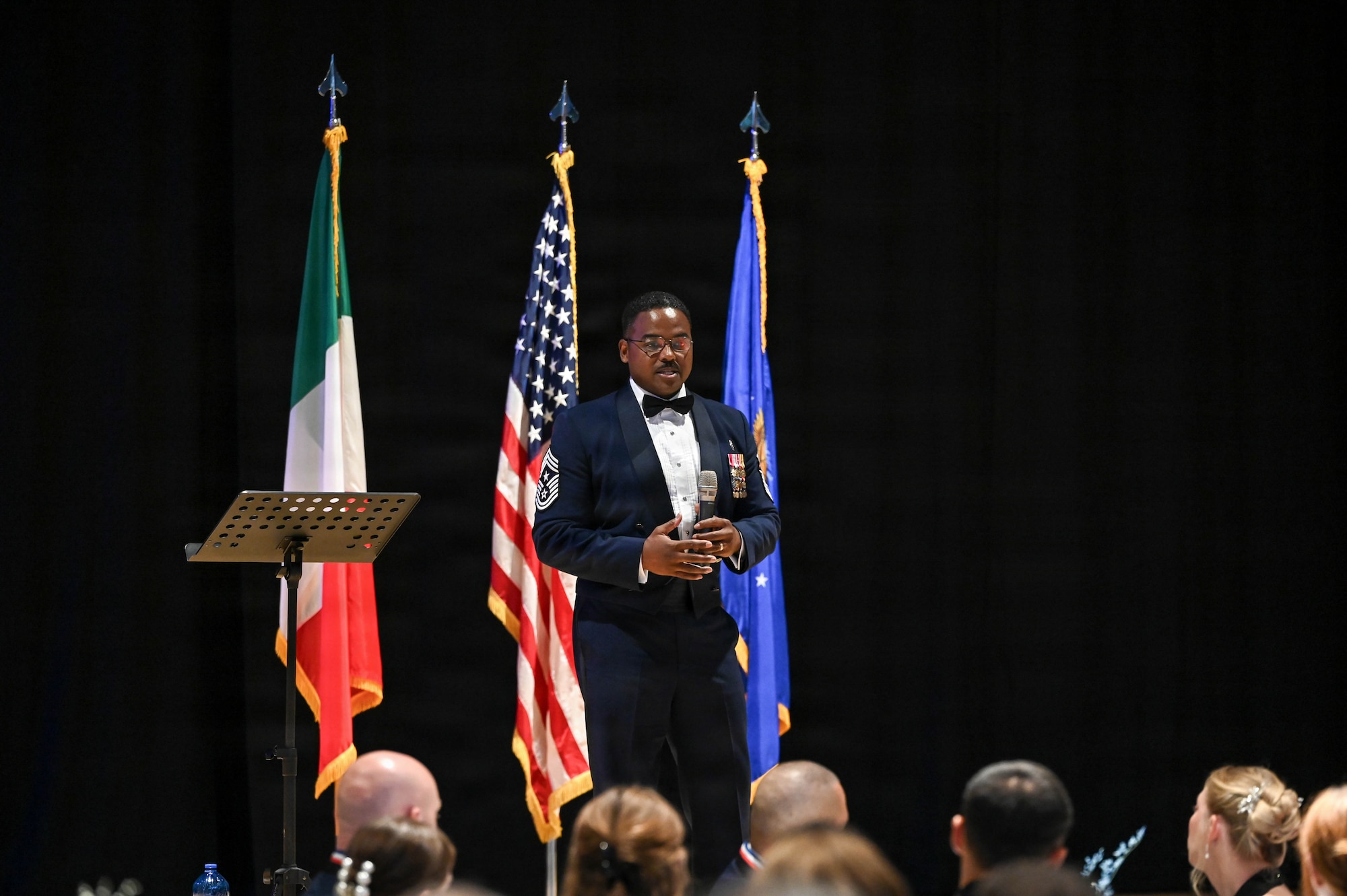 U.S. Air Force Chief Master Sgt. Jerry Dunn, Medical Readiness Command- Bravo Command Chief, speaks to the newly inducted Master Sgts. of the 31st Fighter Wing during their Senior Noncommissioned Officer Induction ceremony near Aviano Air Base, Italy, Aug. 21, 2026.