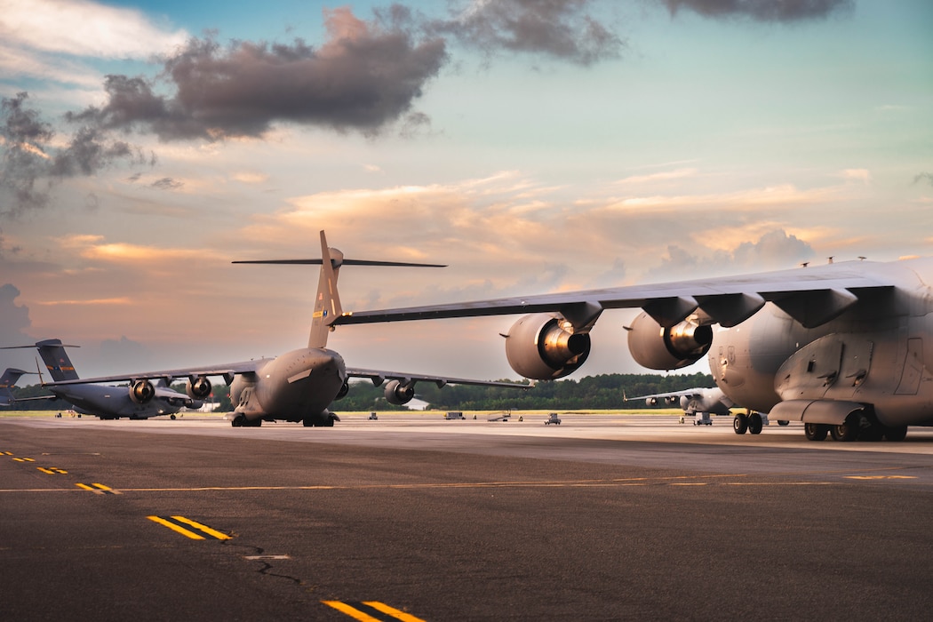 C-17 Globemaster IIIs taxi across the flightline at Joint Base Charleston, S.C., Aug. 4, 2026. The C-17 provides rapid global mobility in support of national objectives worldwide. (U.S. Air Force photo by Airman 1st Class Braxton Grant Stokes)