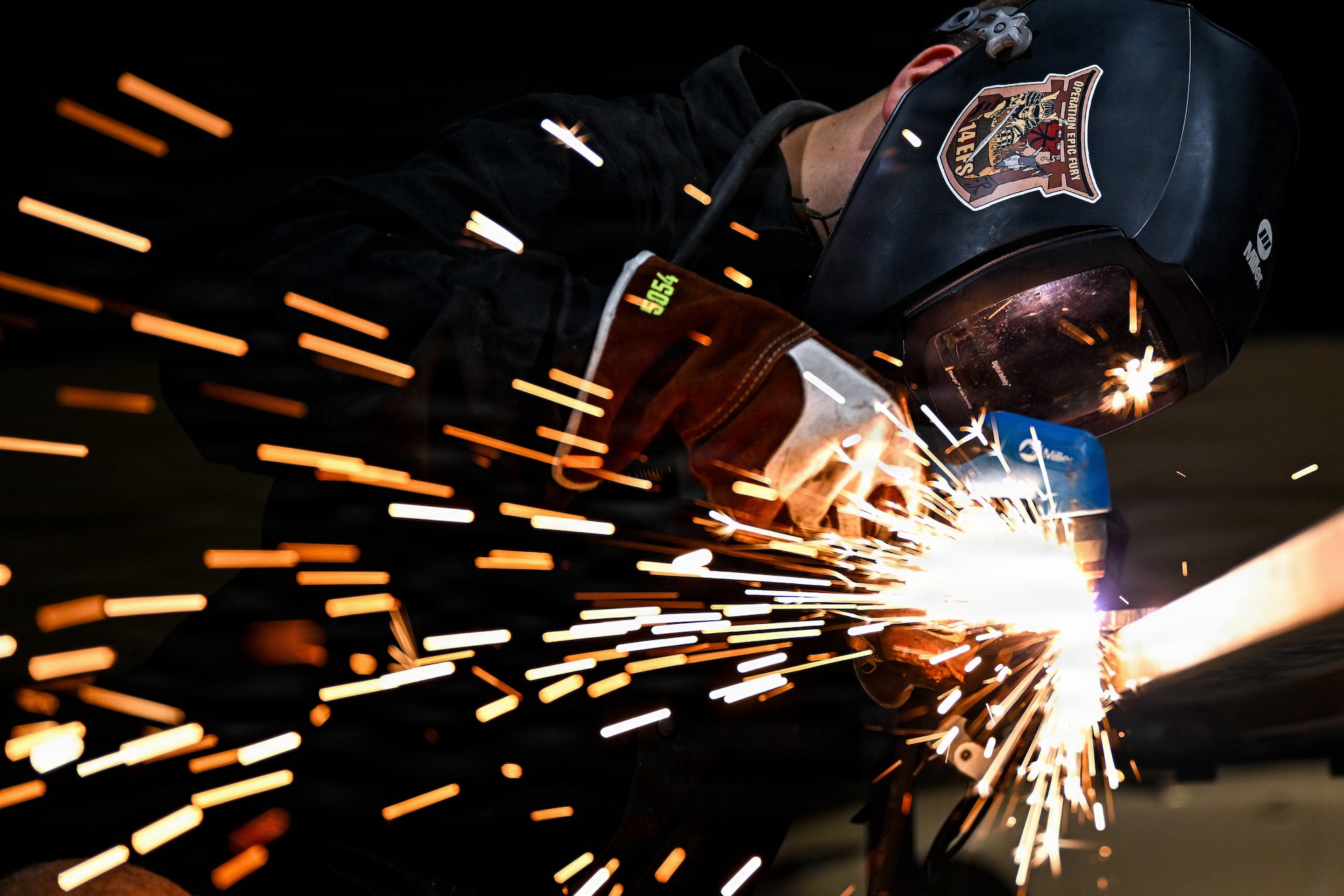 A U.S. Air Force aircraft metals technology specialist uses a plasma cutter to shape raw materials at an undisclosed location within the U.S. Central Command area of responsibility, Aug. 14, 2026. Metals technology specialists use precision welding and machining to manufacture critical components, keeping regional combat aircraft mission ready. (U.S. Air Force photo by Staff Sgt. Justin W. Moore)