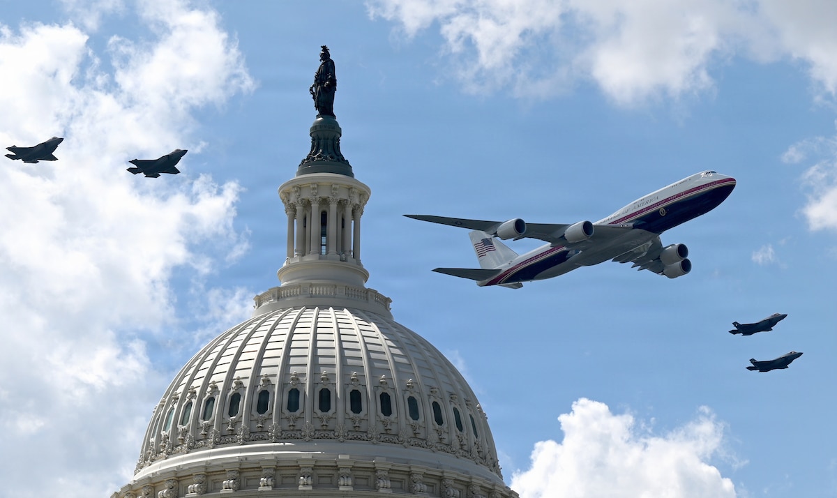 Air Force One, flanked by F-35A Lightning II aircraft, performs a flyover near the U.S. Capitol in Washington, Aug. 23, 2026. The flyover was part of the Freedom 250 Grand Prix held along a portion of the National Mall. (U.S. Airforce photo by Andy Morataya)