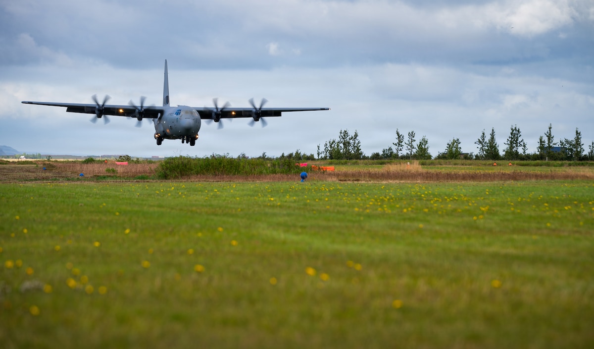 A U.S. Air Force C-130J Super Hercules aircraft assigned to the 37th Airlift Squadron approaches an austere grass landing zone in Iceland, Aug. 23, 2026. Personnel from the 435th Contingency Response Group surveyed and marked the strip during exercise Northern Viking 26 to practice rapid combat power projection across the North Atlantic. (U.S. Air Force photo by Senior Airman Edgar Grimaldo)