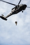 Soldiers assigned to the 1st Battalion, 147th Aviation Regiment, Wisconsin Army National Guard, conduct medical evacuation hoist training with role players portraying simulated casualties at the Combined Arms Collective Training Facility at Fort McCoy, Wisconsin, Aug. 24, 2026. Patriot 26, an Air National Guard-hosted exercise taking place at Volk Field Combat Readiness Training Center, brings together about 1,000 Airmen and Soldiers from National Guard units across 35 states, along with federal, state and local agencies, to enhance domestic response readiness and interagency coordination during large-scale emergencies. The scenario allows aircrews to practice locating, hoisting and evacuating simulated patients from areas where terrain or other conditions may prevent an aircraft from landing. Photo by Sgt. 1st Class Brittany Conley.