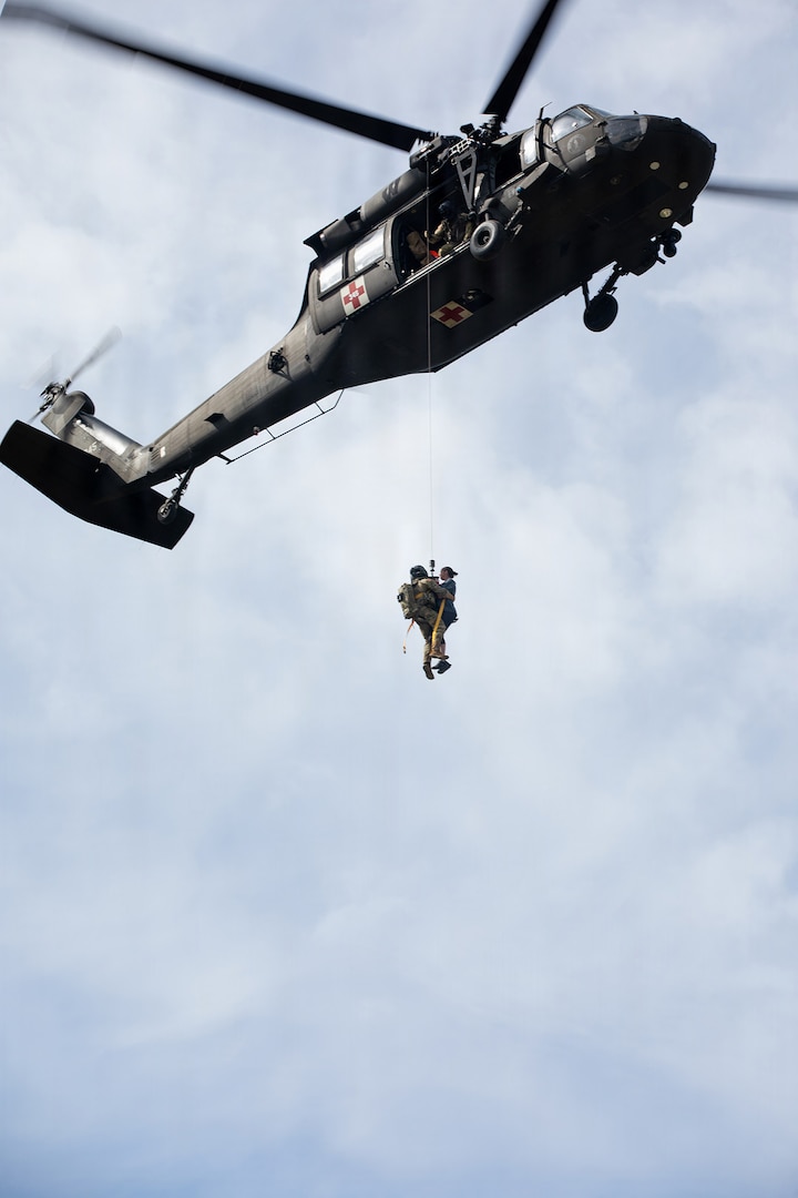 Wisconsin Army National Guard, conduct medical evacuation hoist training with role players portraying simulated casualties at the Combined Arms Collective Training Facility at Fort McCoy, Wisconsin, Aug. 24, 2026.
