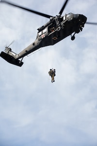 Wisconsin Army National Guard, conduct medical evacuation hoist training with role players portraying simulated casualties at the Combined Arms Collective Training Facility at Fort McCoy, Wisconsin, Aug. 24, 2026.