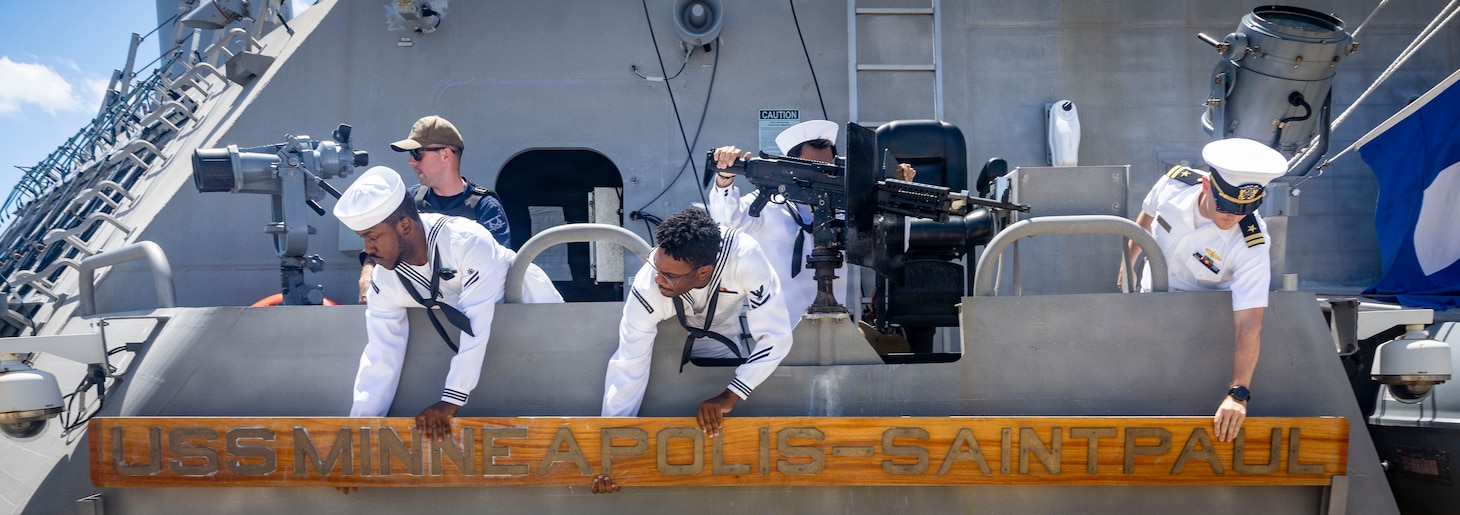 260827-N-VW723-0040 NAVAL STATION MAYPORT, Fla. (Aug. 27, 2026) - Sailors aboard Freedom-class littoral combat ship USS Minneapolis-Saint Paul (LCS 21) attach their namesake before departing Naval Station Mayport to begin operations in support of its scheduled deployment, Aug. 27, 2026. Littoral combat ships are fast, agile, mission-focused platforms designed to operate in near-shore environments and defeat 21st-century coastal threats, supporting the U.S. Navy's goals of forward presence, maritime security, sea control, and deterrence. (U.S. Navy photo by Mass Communication Specialist 1st Class Keenan Daniels)