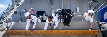 260827-N-VW723-0040 NAVAL STATION MAYPORT, Fla. (Aug. 27, 2026) - Sailors aboard Freedom-class littoral combat ship USS Minneapolis-Saint Paul (LCS 21) attach their namesake before departing Naval Station Mayport to begin operations in support of its scheduled deployment, Aug. 27, 2026. Littoral combat ships are fast, agile, mission-focused platforms designed to operate in near-shore environments and defeat 21st-century coastal threats, supporting the U.S. Navy's goals of forward presence, maritime security, sea control, and deterrence. (U.S. Navy photo by Mass Communication Specialist 1st Class Keenan Daniels)
