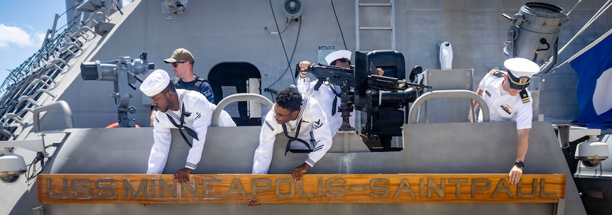 260827-N-VW723-0040 NAVAL STATION MAYPORT, Fla. (Aug. 27, 2026) - Sailors aboard Freedom-class littoral combat ship USS Minneapolis-Saint Paul (LCS 21) attach their namesake before departing Naval Station Mayport to begin operations in support of its scheduled deployment, Aug. 27, 2026. Littoral combat ships are fast, agile, mission-focused platforms designed to operate in near-shore environments and defeat 21st-century coastal threats, supporting the U.S. Navy's goals of forward presence, maritime security, sea control, and deterrence. (U.S. Navy photo by Mass Communication Specialist 1st Class Keenan Daniels)