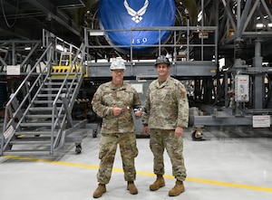 Senior Master Sgt. Chad Bryant (left) and Master Sgt. Tyler Dickson, 512th Maintenance Squadron maintainers, display their creation, a gauge for a variable stator vane lever linkages rigging set for a C-5M Super Galaxy aircraft, at Dover Air Force Base, Delaware, Aug. 1, 2026. The rigging set can reduce the time spent on adjusting the system from 200 to 16 man-hours. (U.S. Air Force photo by Jeremy Larlee)