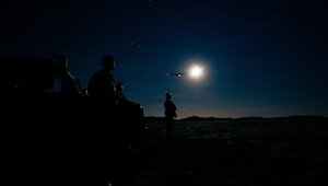 Airmen assigned to the 86th Aircraft Maintenance Squadron and 235th Combat Airfield Operations Squadron, observe a 37th Airlift Squadron C-130J Super Hercules aircraft depart a sand landing zone in Rømø, Denmark