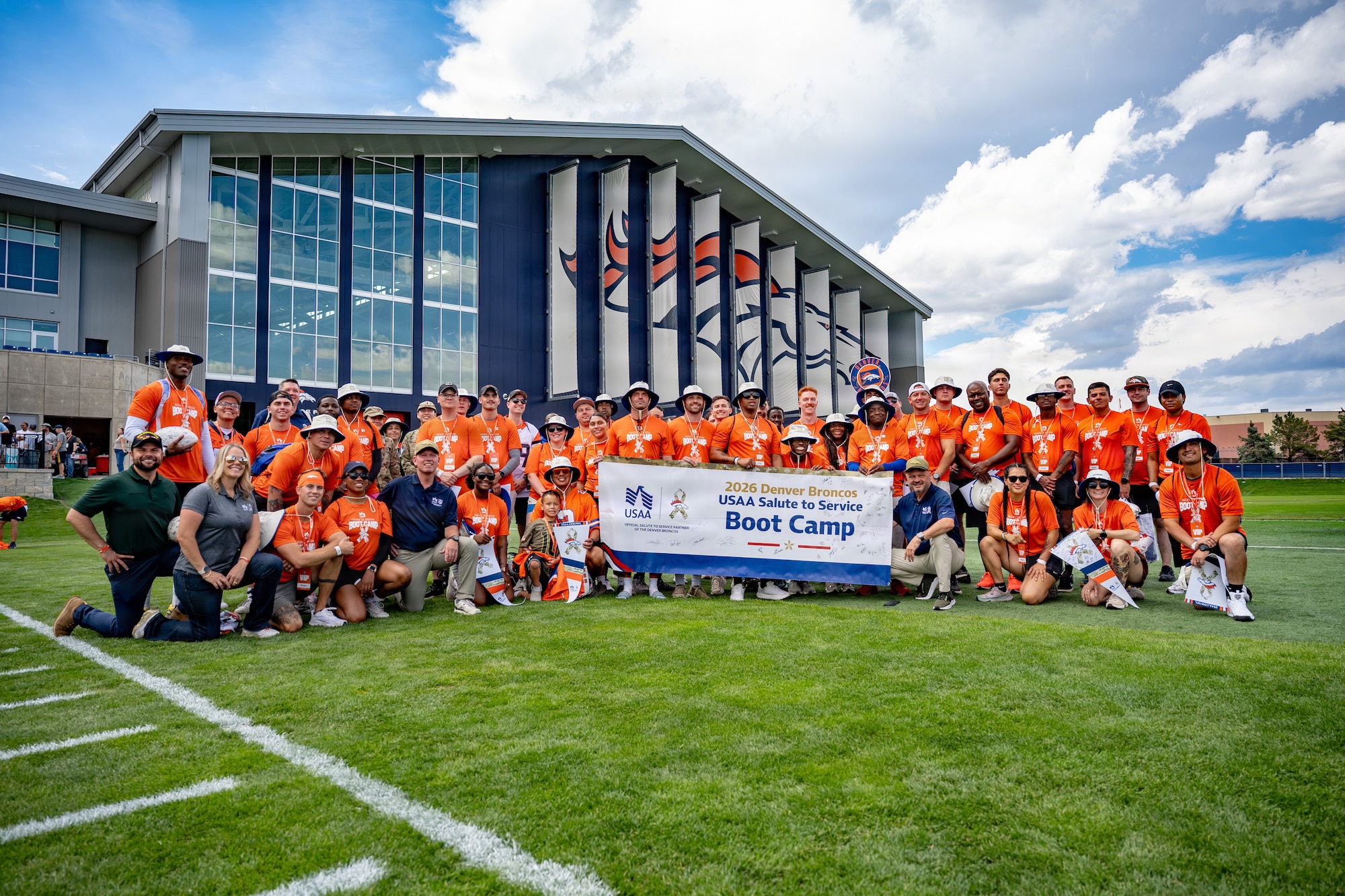 U.S. service members from various local military installations pose for a group photo at the end of the USAA Salute to Service Boot Camp