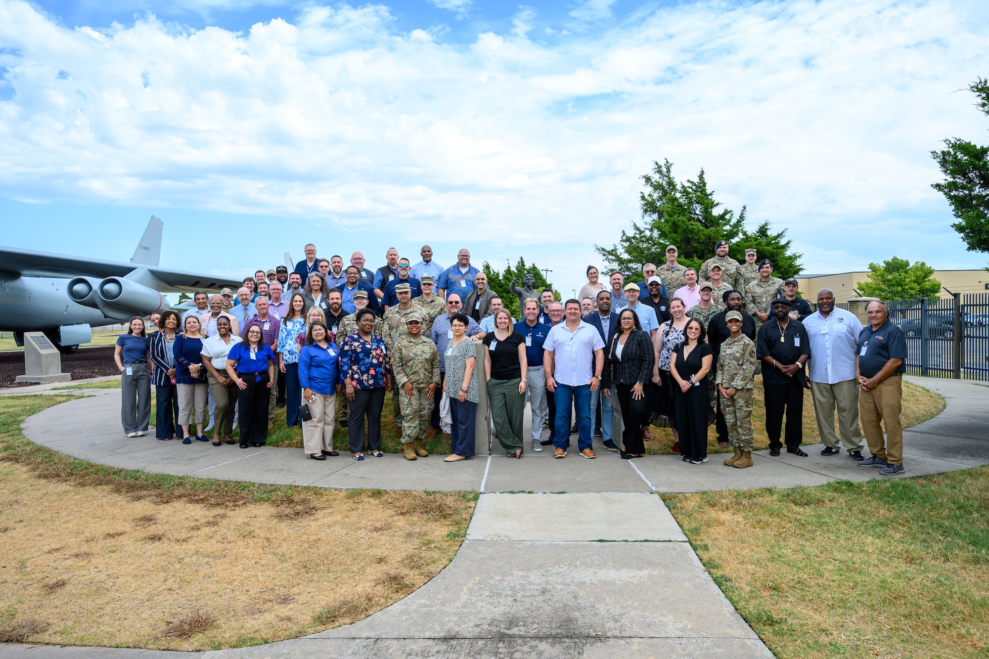 Uniformed and non-uniformed personnel gather at tables