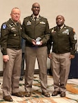U.S. Army Chaplain Edward Lartey with the District of Columbia National Guard, assigned to Joint Task Force- District of Columbia, receives the Military Chaplains Association USA Distinguished Service Award at the DC Armory on August 7, 2026. About 4,600 National Guard members are supporting the mission, providing critical assistance to the Metropolitan Police Department to help ensure the safety of residents, commuters, and visitors throughout the District.