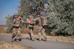 Airmen participate in a ruck.