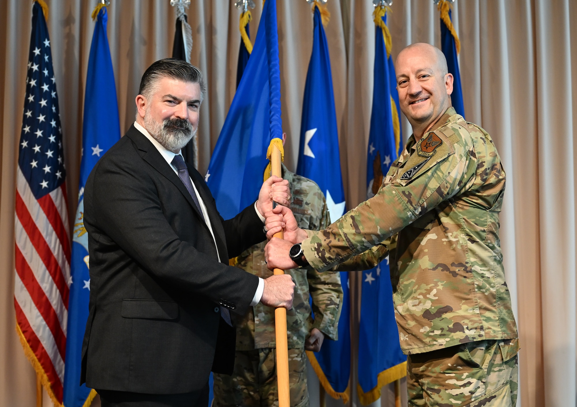 Brig. Gen. Joshua Williams assumes leadership of the Department of the Air Force Portfolio Acquisition Executive for Command, Control, Communications and Battle Management from Lt. Gen. Jason Voorheis, Air Force Life Cycle Management Center commander, during a change of leadership ceremony here, Aug. 28. Williams officially assumed leadership of C3BM on July 31, 2026, and the ceremony served as the ceremonial transfer of authority and responsibility. (Official Air Force Photo by Morgan Brown)