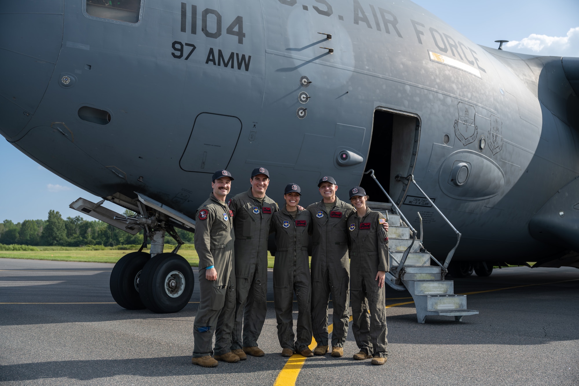 The Altus Air Force Base C-17 Globemaster III demonstration team smiles in front of the U.S. Air Force C-17 Globemaster III aircraft in London, Ontario, Aug. 20, 2026. The C-17 demonstration team consisted of three instructor pilots and two evaluator loadmasters. (U.S. Air Force photo by Airman 1st Class Emma Wright)