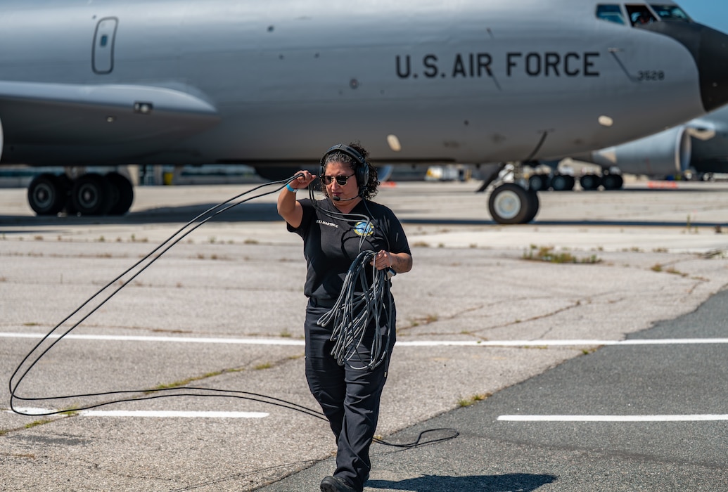 Julianne Martinez, 97th Maintenance Group KC-135 crew chief, completes pre-flight checks prior to the Altus KC-135 demonstration team performing in Airshow London 2026, London, Ontario, Aug. 21. 2026. One aspect of Martinez's job at the airshow is overseeing the jet receiving fuel. (U.S. Air Force photo by Airman 1st Class Emma Wright)