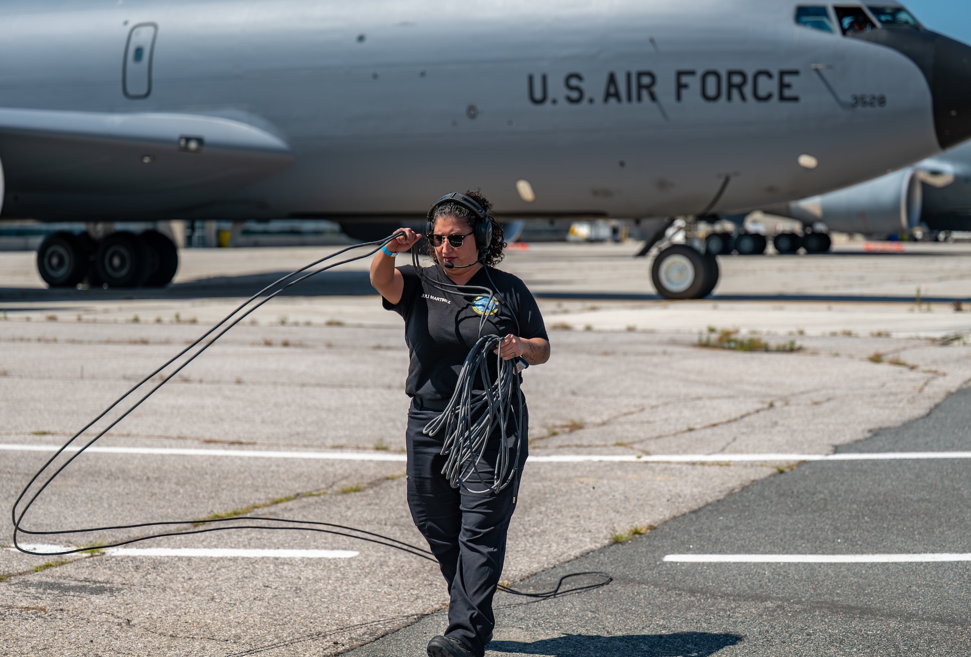 Julianne Martinez, 97th Maintenance Group KC-135 crew chief, completes pre-flight checks prior to the Altus KC-135 demonstration team performing in Airshow London 2026, London, Ontario, Aug. 21. 2026. One aspect of Martinez's job at the airshow is overseeing the jet receiving fuel. (U.S. Air Force photo by Airman 1st Class Emma Wright)