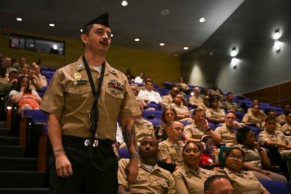 Master-At-Arms 1st Class Jordan Riggs recites “The Watch” at his father’s retirement ceremony, Senior Chief Hospital Corpsman Thomas Riggs, at Walter Reed National Military Medical Center, August 20, 2026. Navy Medicine Readiness and Training Command (NMRTC) Bethesda mission is to maximize warfighter performance through optimized medical readiness tailored to operational requirements; enhance the readiness of the medical force to sustain expeditionary medical capability; and train and develop the Navy Medicine Force. (U.S. Navy photo Mass Communication Specialist Second Class Alec Kramer)