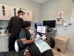 Hospital Corpsman Lydia Horne, assigned to Navy Medicine Readiness and Training Unit Portsmouth, NH practices using digital scanning technology to create a three-dimensional image at the naval health clinic in Portsmouth New Hampshire, August 17, 2026. By combining advanced technology with foundational clinical skills, Navy dental teams are improving efficiency, strengthening corpsman proficiency and increasing capabilities. Hands-on training ensures technicians can sustain their capabilities for contingent environments. (U.S. Navy photo by Hospital Corpsman First Class Ernesto Espinosacarpio)
