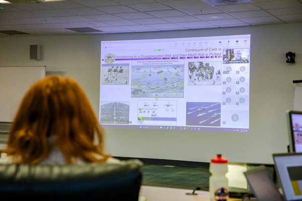 Maj. Gen. Clint Murray, the Joint Staff Surgeon assigned to the Pentagon, discusses operational medical advancements during the Navy Operational Medicine Information Technology & Fielding Summit in Chesapeake, Virginia, Aug. 24, 2026. The five-day summit, held at the CACI Building in Chesapeake, brings together senior leaders from BUMED, Fleet commands, Naval Information Warfare Centers, and Joint Operational Medicine Information Systems teams. The primary objective was to deliver agile, trained, and certified medical units to support the Fleet, Fleet Marine Force and expeditionary medical facilities. (U.S. Navy photo by Mass Communication Specialist 2nd Class Levi Decker)