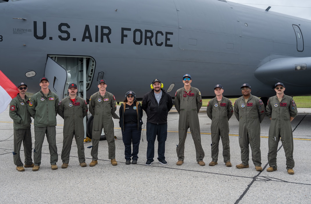 The Altus Air Force Base KC-135 Stratotanker demonstration team smiles in front of the U.S. Air Force KC-135 Stratotanker aircraft in London, Ontario, Aug. 24, 2026. U.S. Air Force Lt. Col. Aaron Brown, 54th Air Refueling Squadron commander, joined the KC-135 demonstration team at the airshow. (U.S. Air Force photo by Airman 1st Class Emma Wright)