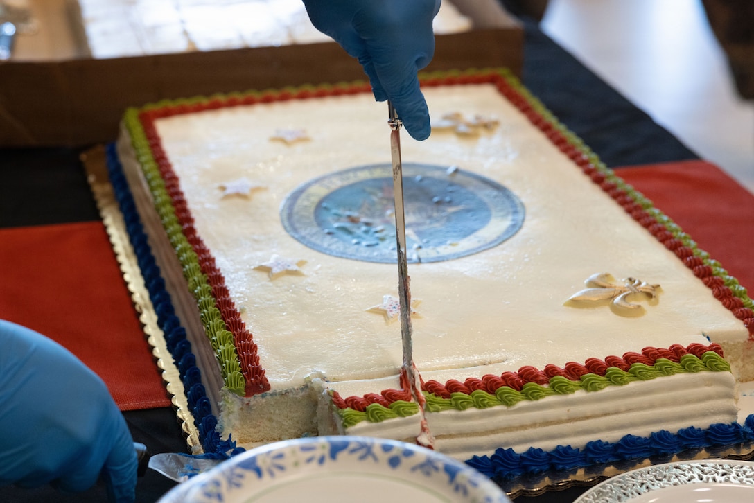 U.S. Marine Corps Gunnery Sgt. Jeffrey Moore, a supply chief with Marine Forces Reserve, passes out cake during a cake-cutting ceremony celebrating the 110th birthday of the Marine Corps Reserve at Marine Corps Support Facility New Orleans, Aug. 28, 2026. The ceremony marks the establishment of the Marine Corps Reserve which was officially founded on Aug. 29, 1916, to provide trained and qualified units to support the active-duty component during times of war or national emergency. (U.S. Marine Corps photo by Cpl. Breysson Villacortacampos)