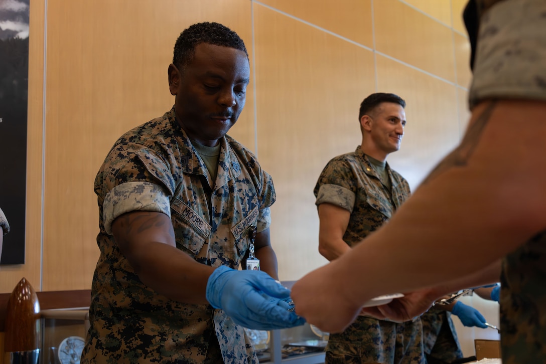 U.S. Marine Corps Gunnery Sgt. Jeffrey Moore, a supply chief with Marine Forces Reserve, passes out cake during a cake-cutting ceremony celebrating the 110th birthday of the Marine Corps Reserve at Marine Corps Support Facility New Orleans, Aug. 28, 2026. The ceremony marks the establishment of the Marine Corps Reserve which was officially founded on Aug. 29, 1916, to provide trained and qualified units to support the active-duty component during times of war or national emergency. (U.S. Marine Corps photo by Cpl. Breysson Villacortacampos)