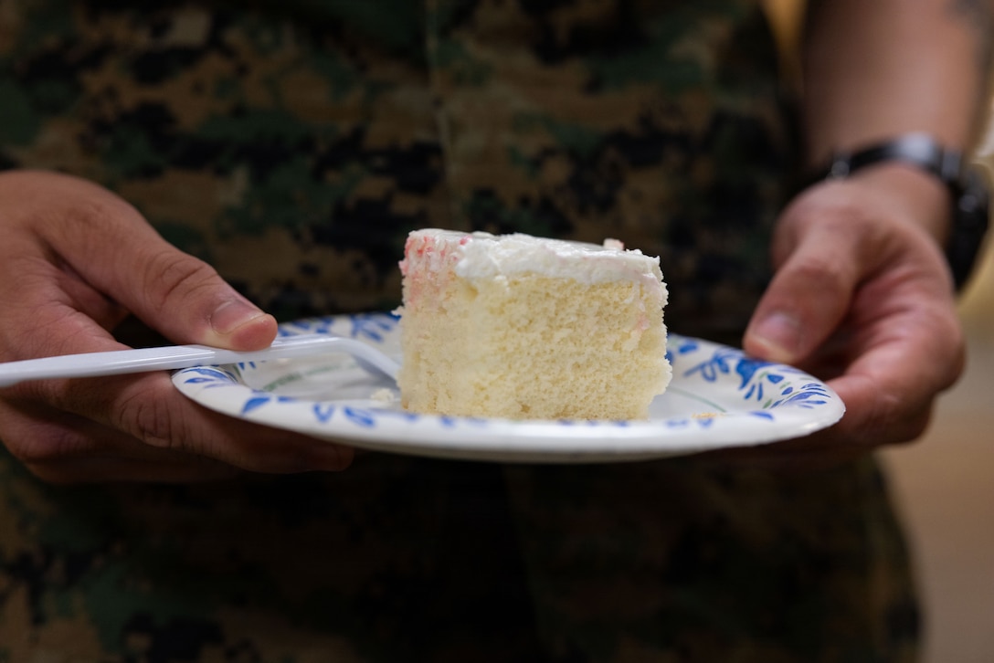 A U.S. Marine with Marine Forces Reserve receives a piece of cake during a cake-cutting ceremony celebrating the 110th birthday of the Marine Corps Reserve at Marine Corps Support Facility New Orleans, Aug. 28, 2026. The ceremony marks the establishment of the Marine Corps Reserve which was officially founded on Aug. 29, 1916, to provide trained and qualified units to support the active-duty component during times of war or national emergency. (U.S. Marine Corps photo by Cpl. Breysson Villacortacampos)