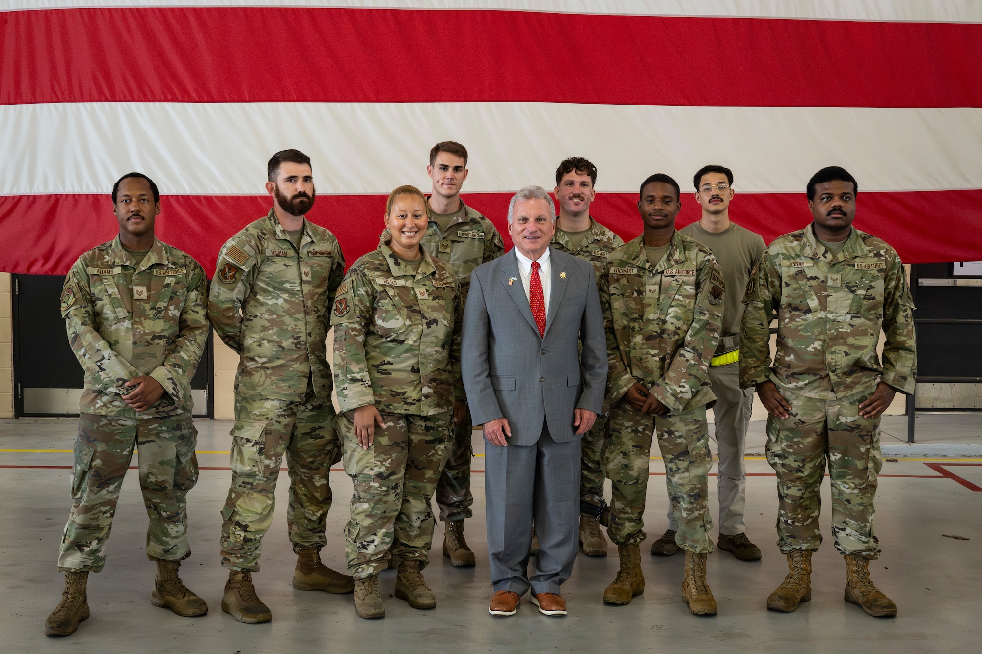 Congressman poses for a group photo with Airmen