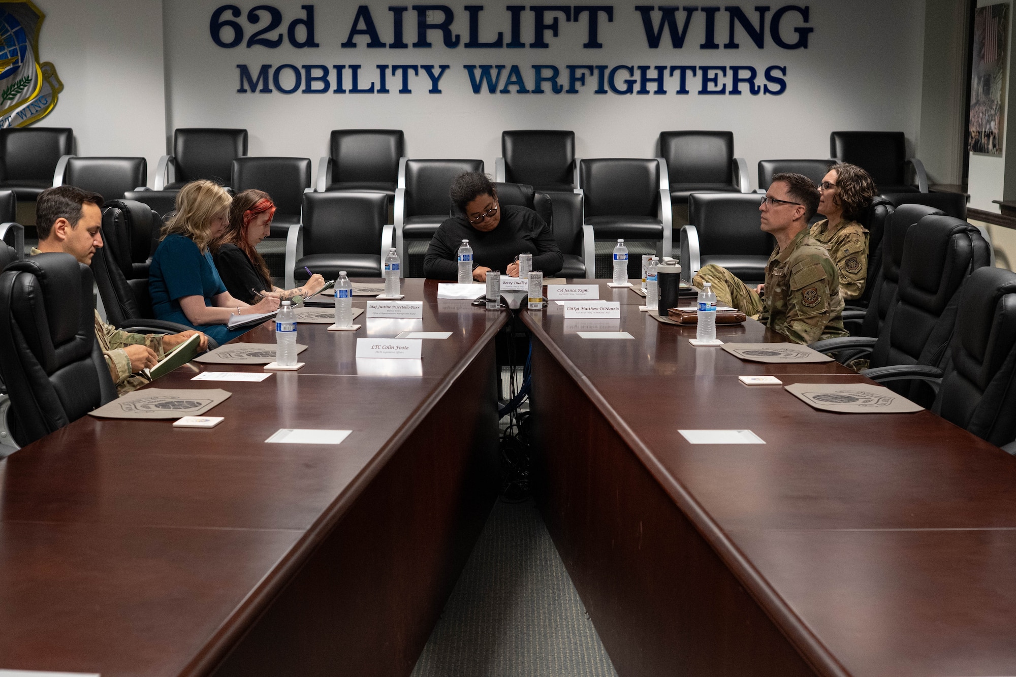 A group sits at a conference table