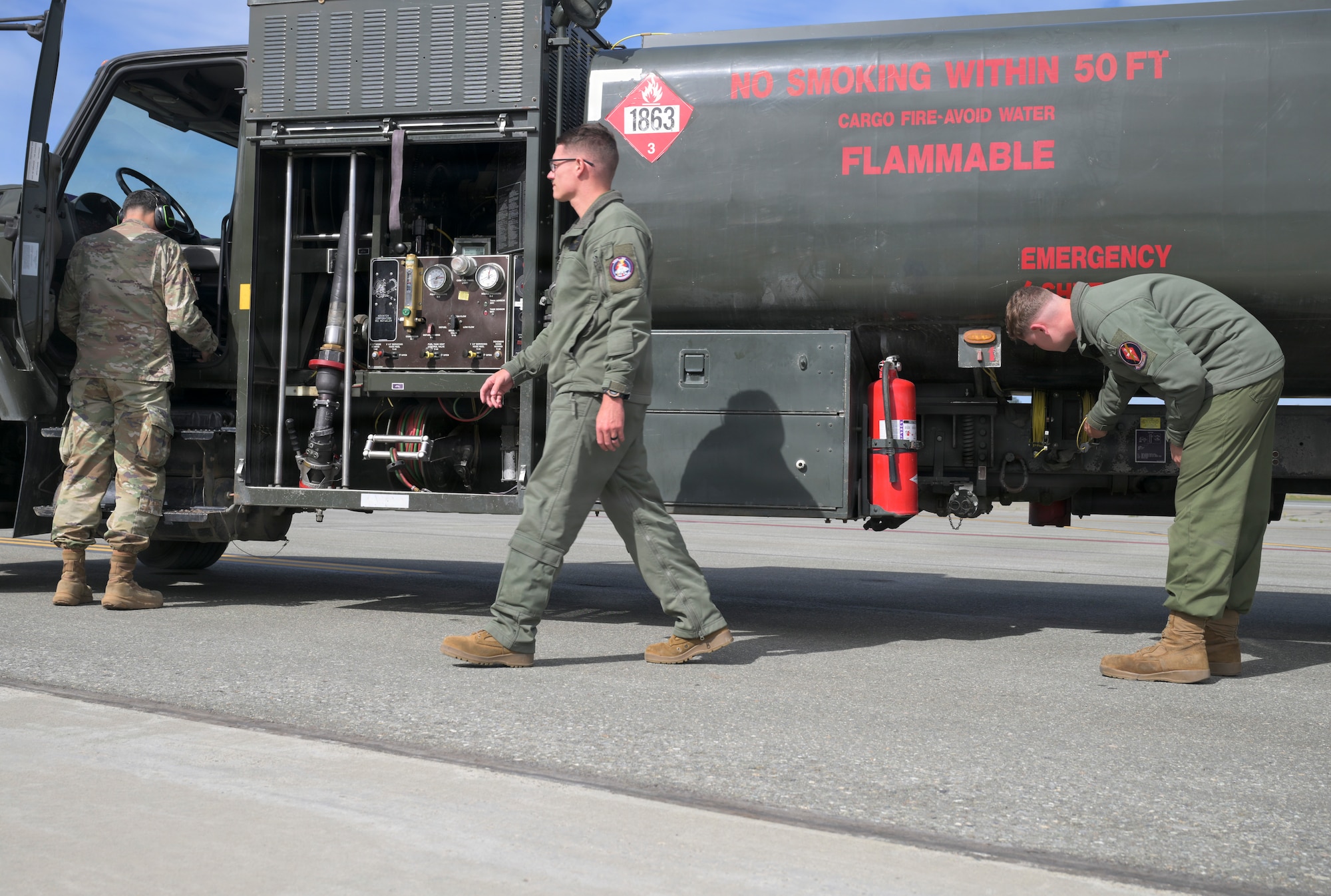 U.S. service members complete administration and safety procedures after refueling aircraft during RED FLAG-Alaska 26-3 at Joint Base Elmendorf-Richardson, Alaska, Aug. 25, 2026. RED FLAG-Alaska replicates Indo-Pacific operational conditions, integrating joint and coalition forces in training from simulated forward operating bases to improve response capability across the range of contingencies.