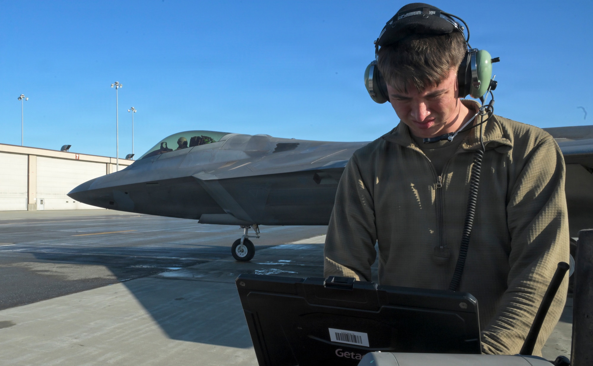 U.S. Air Force Airman 1st Class Daniel Taylor, 3rd Aircraft Maintenance Squadron assistant dedicated crew chief, confirms an F-22 Raptor aircraft assigned to the 90th Fighter Squadron has passed preflight checks during RED FLAG-Alaska 26-3 at Joint Base Elmendorf-Richardson, Alaska, Aug. 26, 2026. RED FLAG-Alaska replicates Indo-Pacific operational conditions, integrating joint and coalition forces in training from simulated forward operating bases to improve response capability across a range of contingencies.