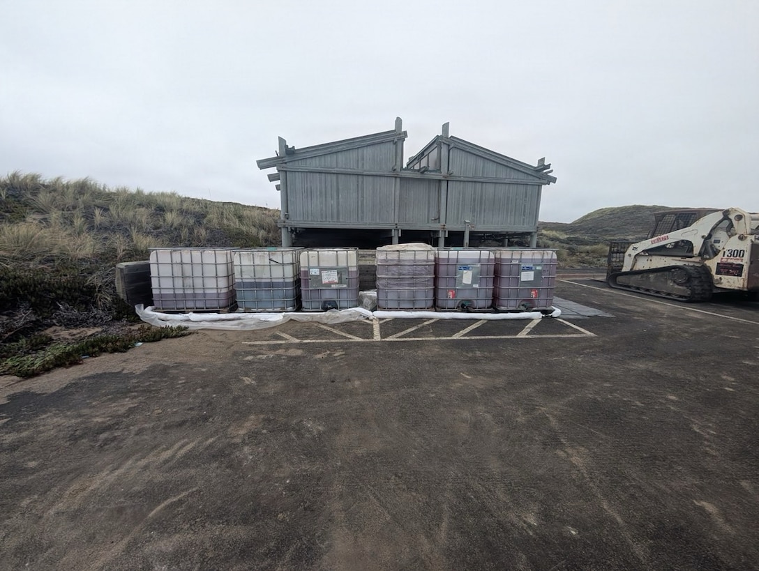 Intermediate bulk containers filled with petroleum products removed from the aground fishing vessel Lake Bay sit at a staging site near Point Reyes North Beach, California, August 22, 2026. A unified command was formed to respond to the incident as a pollution threat in the Greater Farallones National Marine Sanctuary. (U.S. Coast Guard
courtesy photo)
